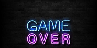 Game Over neon sign on brick wall