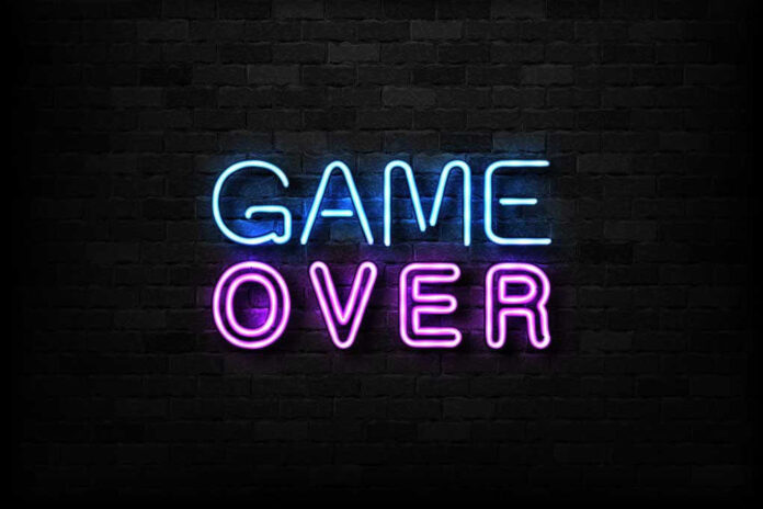 Game Over neon sign on brick wall