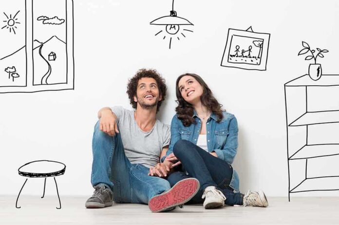 shutterstock_206266147.jpg A couple sitting on the floor against a wall with playful illustrations