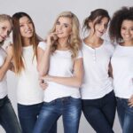 Medical SCANDAL Terrified Millions of Women Five women in white tshirts and jeans smiling together